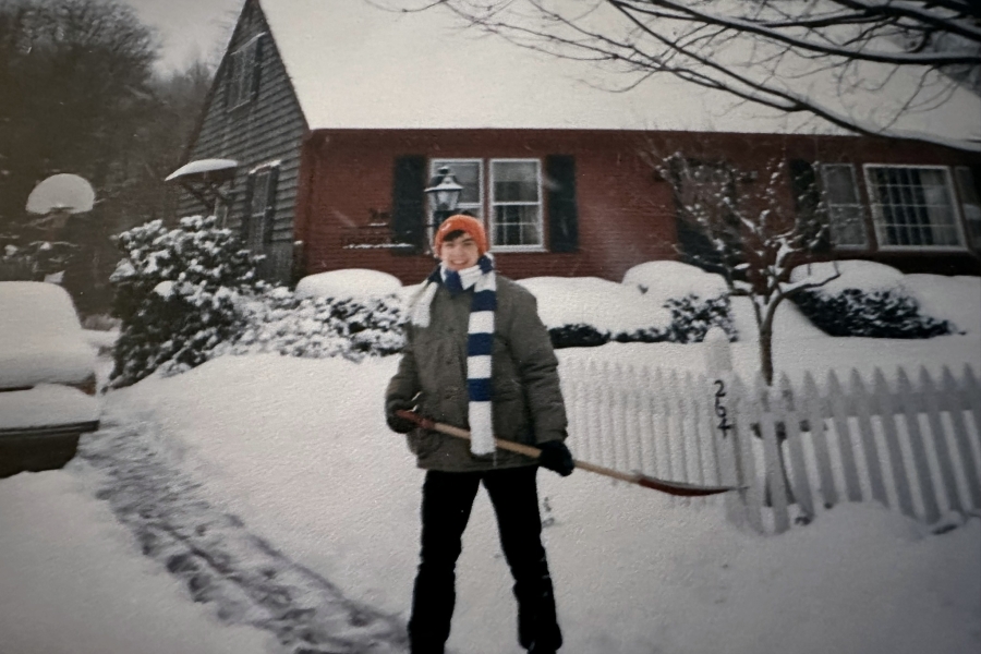 A young James Ruggieri shovels snow outside his home in Barrington, Rhode Island.
