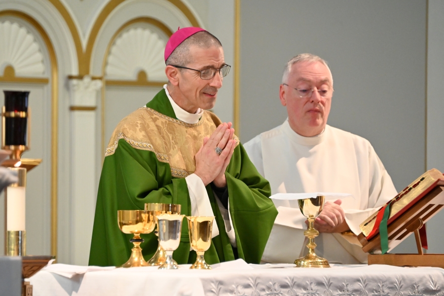 Bishop Ruggieri celebrates the Liturgy of the Eucharist, with Msgr. Marc Caron.