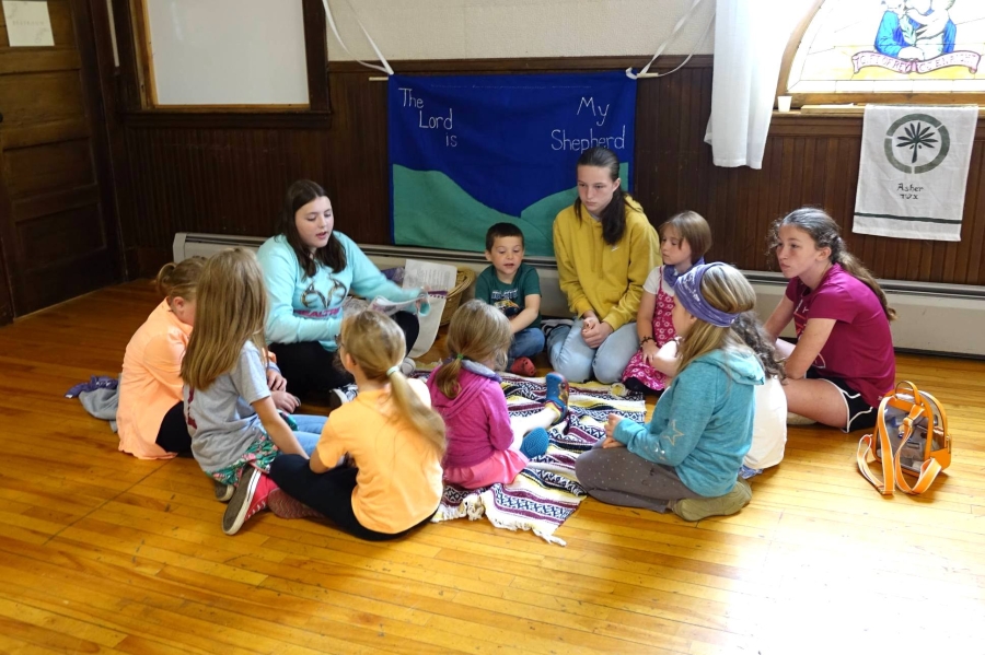 Children sitting in a circle on the floor