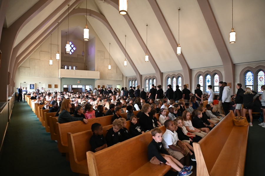 students sitting in church 