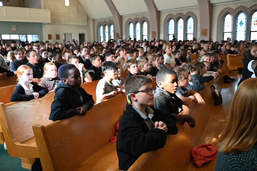 Students praying in pews