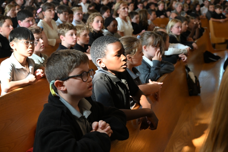 students praying in pews