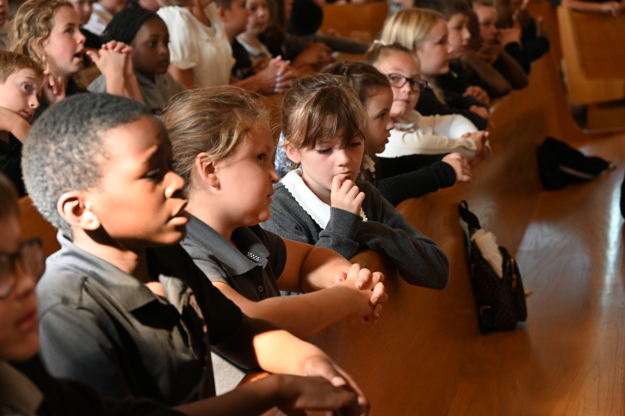 students praying in pews