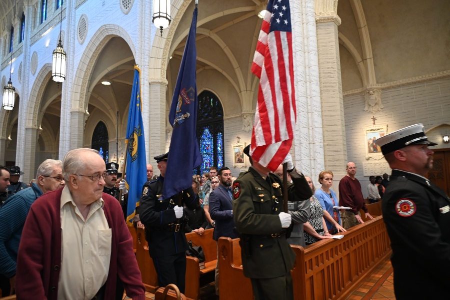 law enforcement bringing flags into the basilica