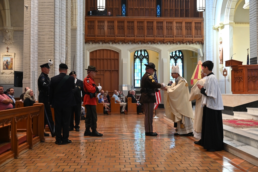 law enforcement bringing up liturgical gifts 