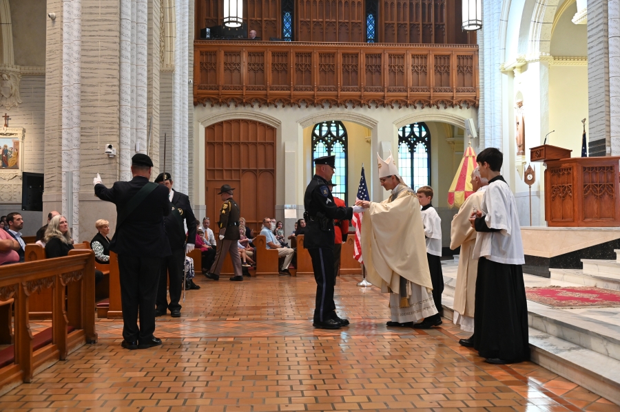 law enforcement bringing up liturgical gifts 