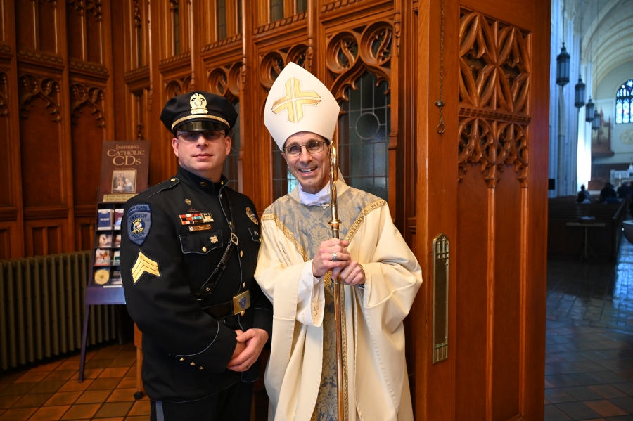 Bishop Ruggieri with a member of law enforcement 