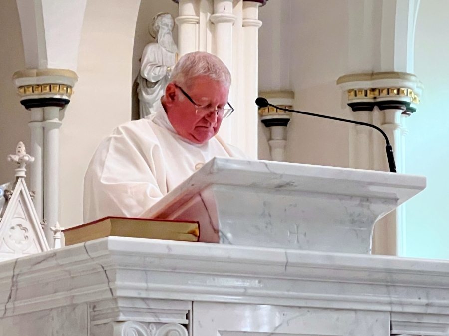 Deacon Jeffrey Lewis reads the Gospel.