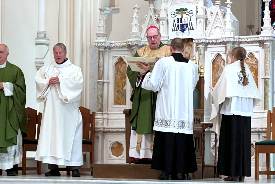 Bishop Robert Deeley gives the opening prayer.