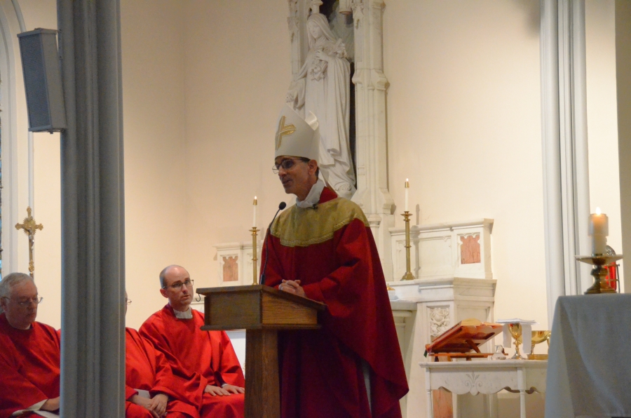 Bishop speaking on altar