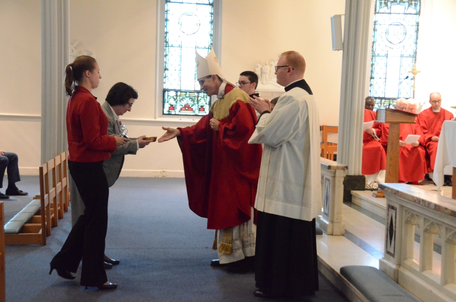 Bishop receiving liturgical gifts