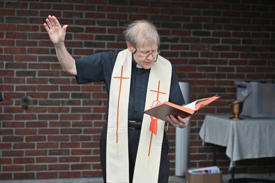 Father Michalowski offering a blessing.