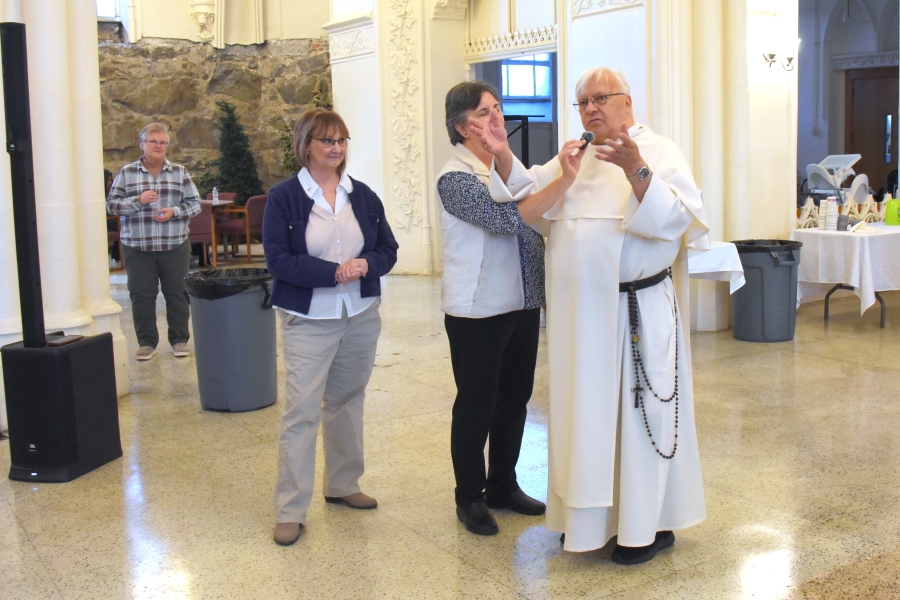 Brother Irenee Richard, OP speaks at a reception in his honor.