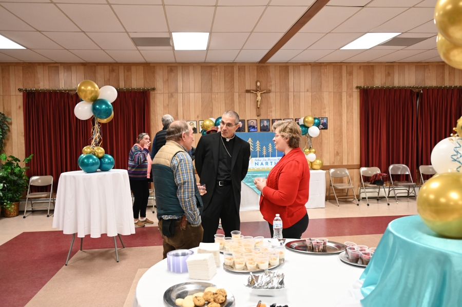 Bishop speaking to a couple