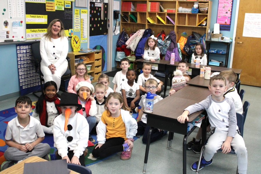 Students at All Saints Catholic School dress like snowmen.