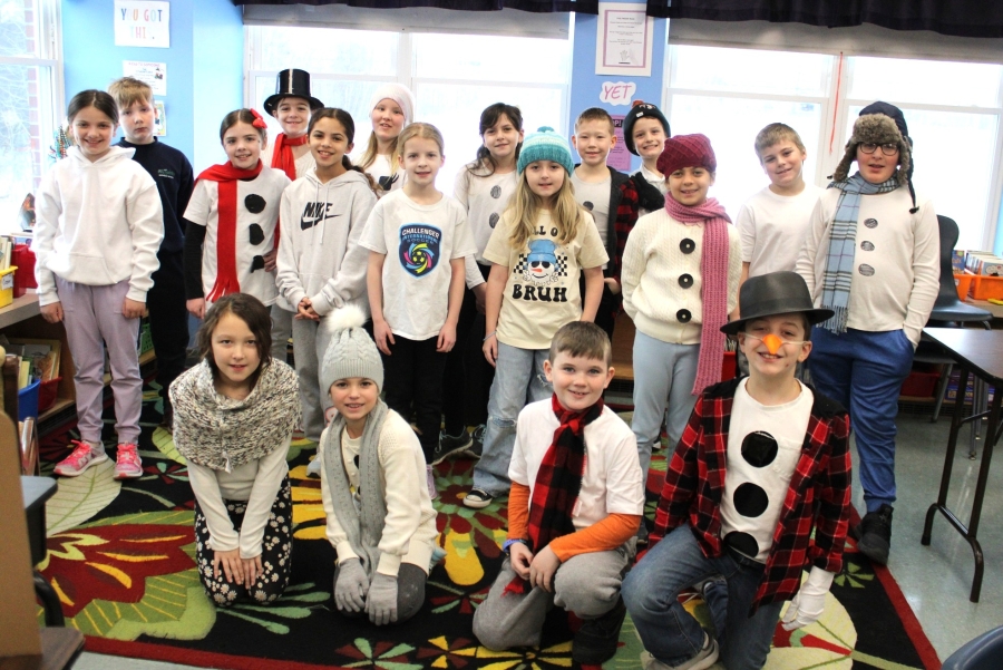 Students at All Saints Catholic School dress like snowmen.