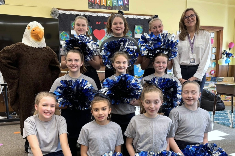 St. Thomas School cheerleaders and eagle mascot.