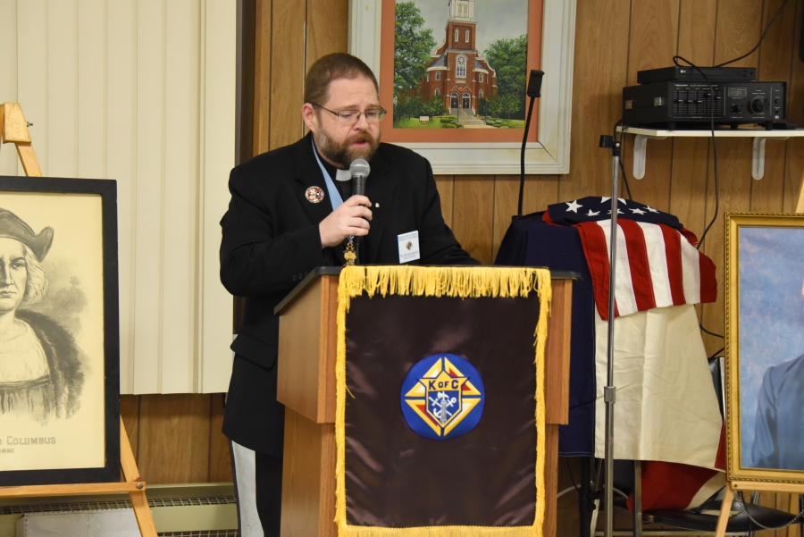 Father Nathan March speaks at the reception.