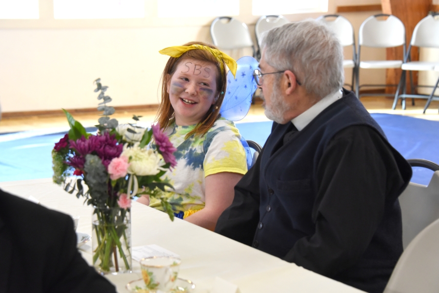 Father Paul Sullivan, SJ, and a student