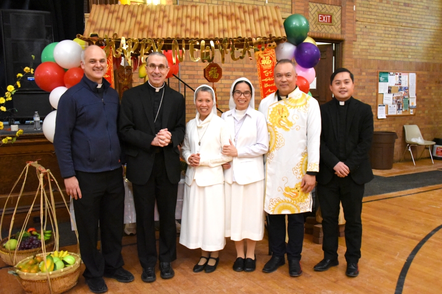 Father Seamus Griesbach, Bishop James Ruggieri, two Servants of the Blessed Sacrament, Father Dinh Votran, and Vinh Nguyen
