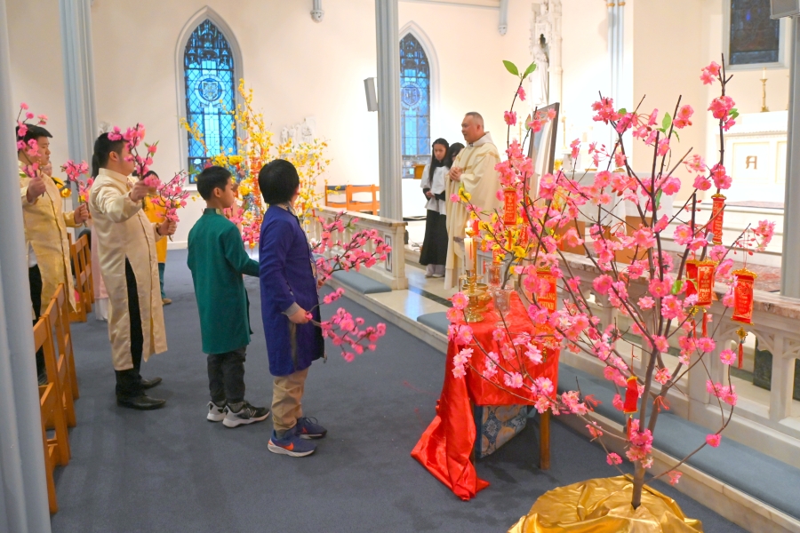 Children bring up the offertory gifts.