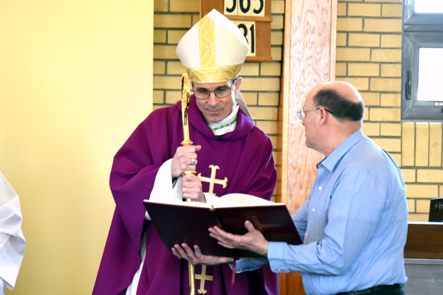 Bishop Ruggieri examines a Book of the Elect