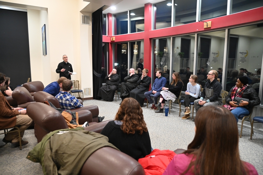 Students and Bishop James Ruggieri in a discussion group.