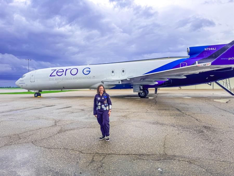 karin paquin in front of zero-g plane