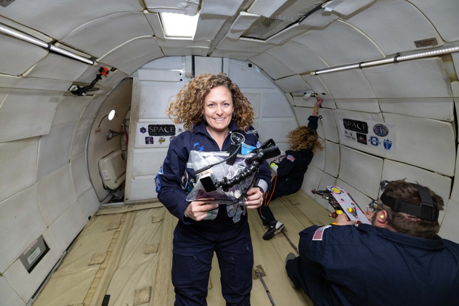 Karin Paquin floats in microgravity with her student's experiments