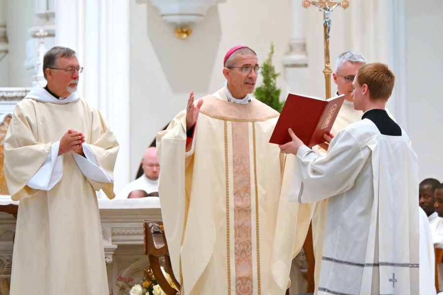 Bishop Ruggieri prays