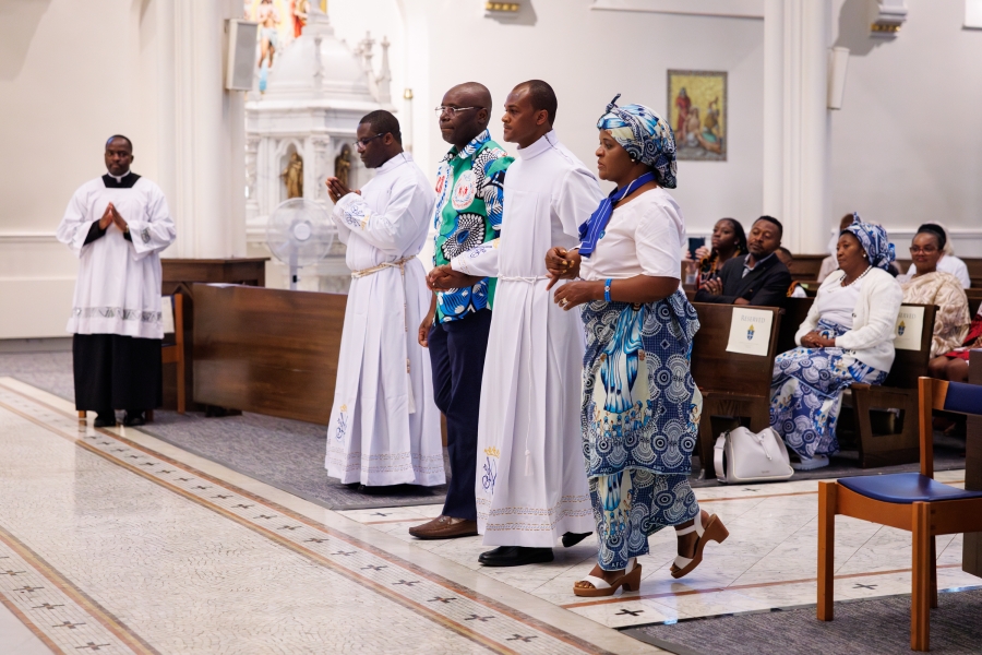 Friends present Ezekiel Yisi Banla to the bishop.