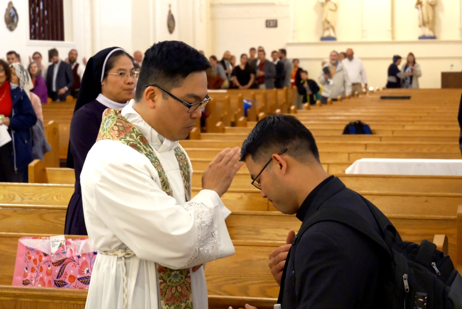 Father Thanh Duc Pham offers a blessing.
