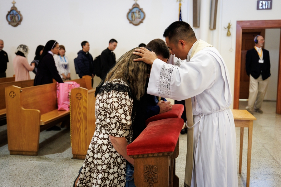 Father Hoa Tien Nguyen offers a blessing.