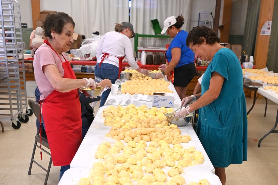Women frosting cookies.