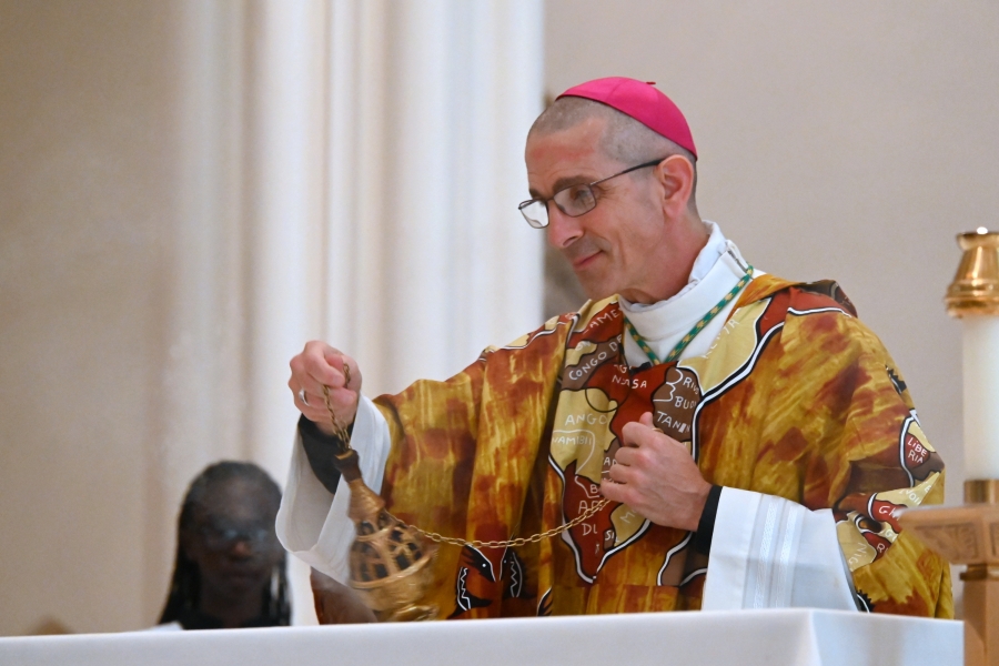 Bishop James Ruggieri incenses the altar.
