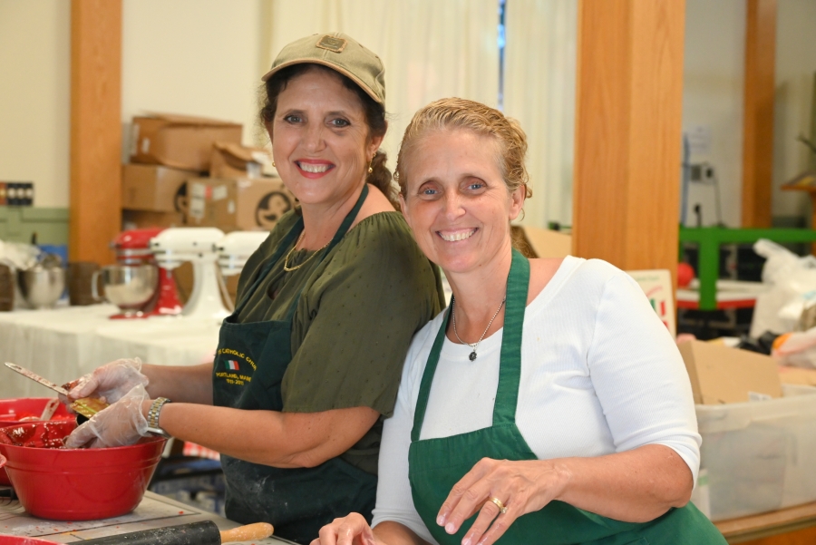 Sisters making Italian loaf cookies.
