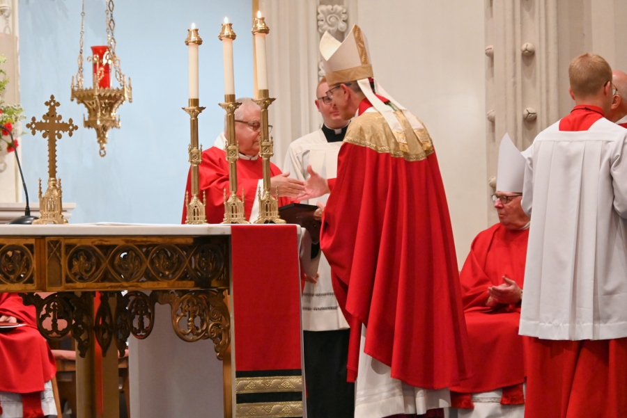 Bishop James Ruggieri makes a presenation to Msgr. Jean-Paul Labrie