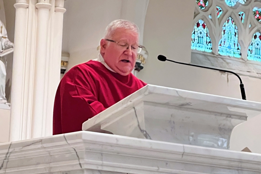 Deacon Jeffrey Lewis delivers the Gospel reading.