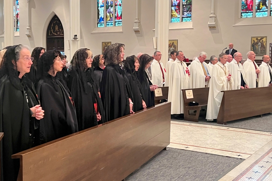 Members of the Equestrian Order of the Holy Sepulchre of Jerusalem with ladies in the foreground.