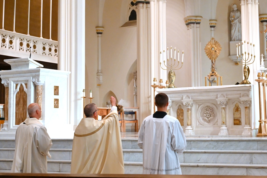 Bishop Ruggieri incensing the altar with the Blessed Sacrament.