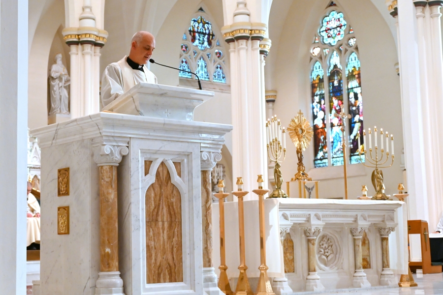 Father Seamus Griesbach reads the Gospel.