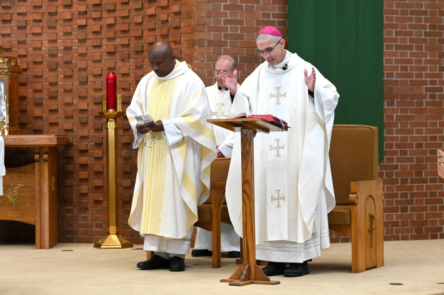 Bishop James Ruggieri gives the opening prayer.