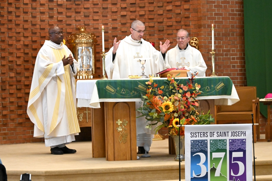 Bishop James Ruggieri, Father Patrick Agbodi, and Father Frank Morin celebrate the Liturgy of the Eucharist.
