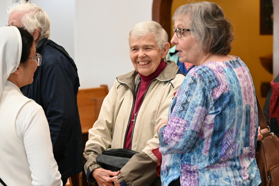 Sister Dorine Moreau shares a laugh with a friend.