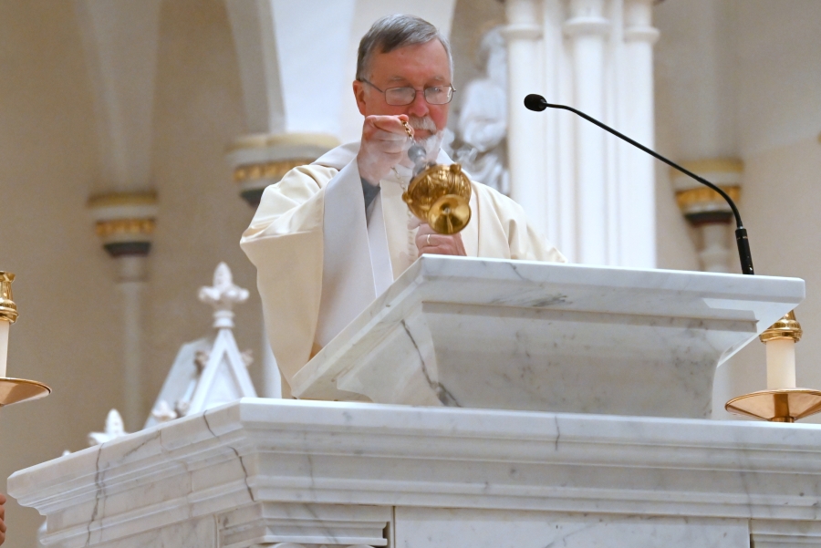 Deacon Peter Bernier incenses the Book of the Gospels.