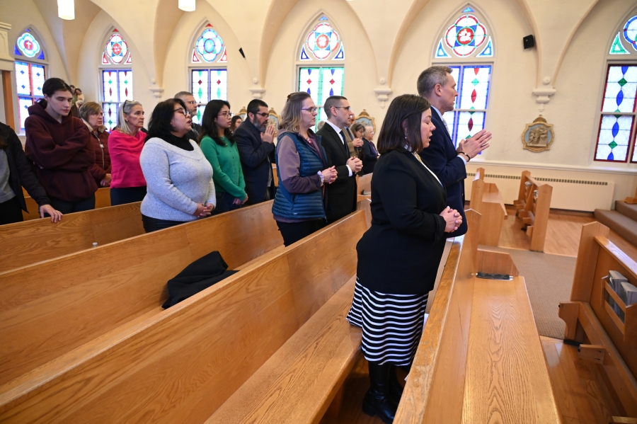 The deacon candidates and their wives in the pews.