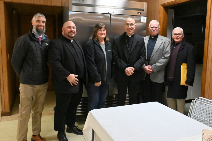 Michael Smith, Father Brad Morin, Janet Lepage, Bishop James Ruggieri, Deacon Frank Daggett, and another gentleman.