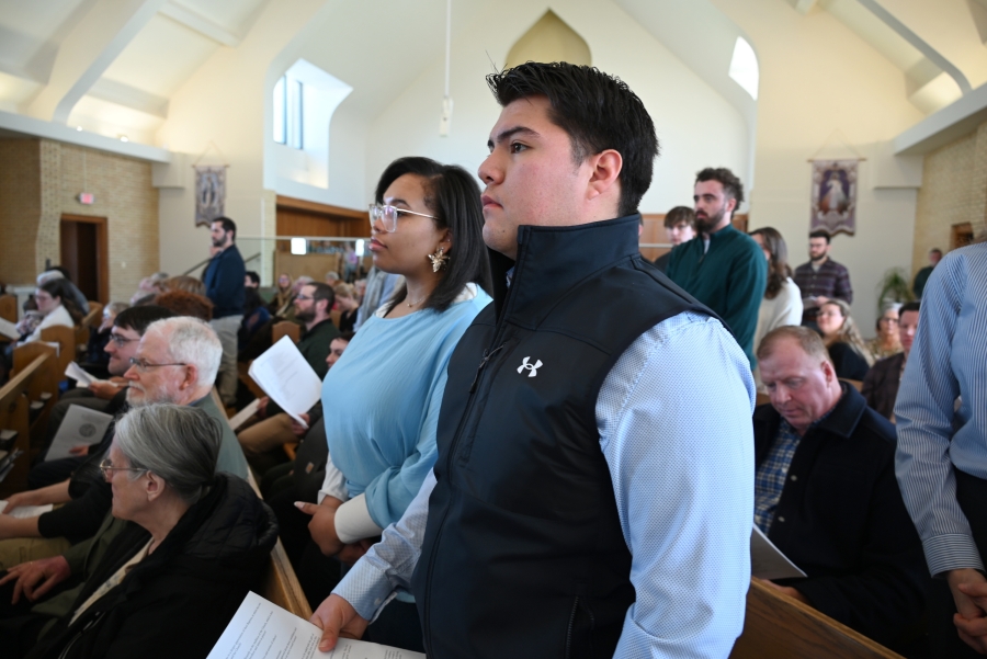 A catechumen/candidate and godparent or sponsor