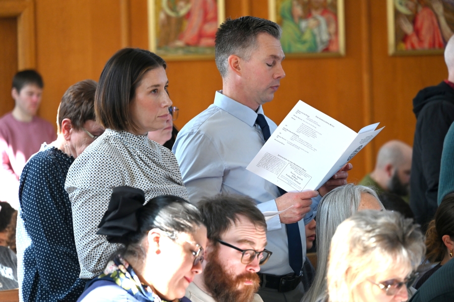 A catechumen/candidate and godparent or sponsor