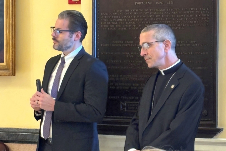 Bishop James Ruggieri and another speaker.